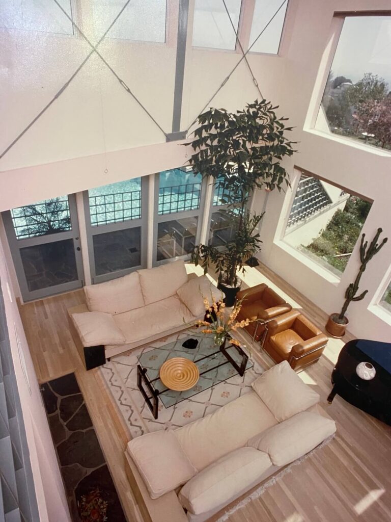 Two-story great room at the Jacob Residence with exposed structural bracing, floor-to-ceiling windows, and panoramic views architecture by Richard Clemenson.